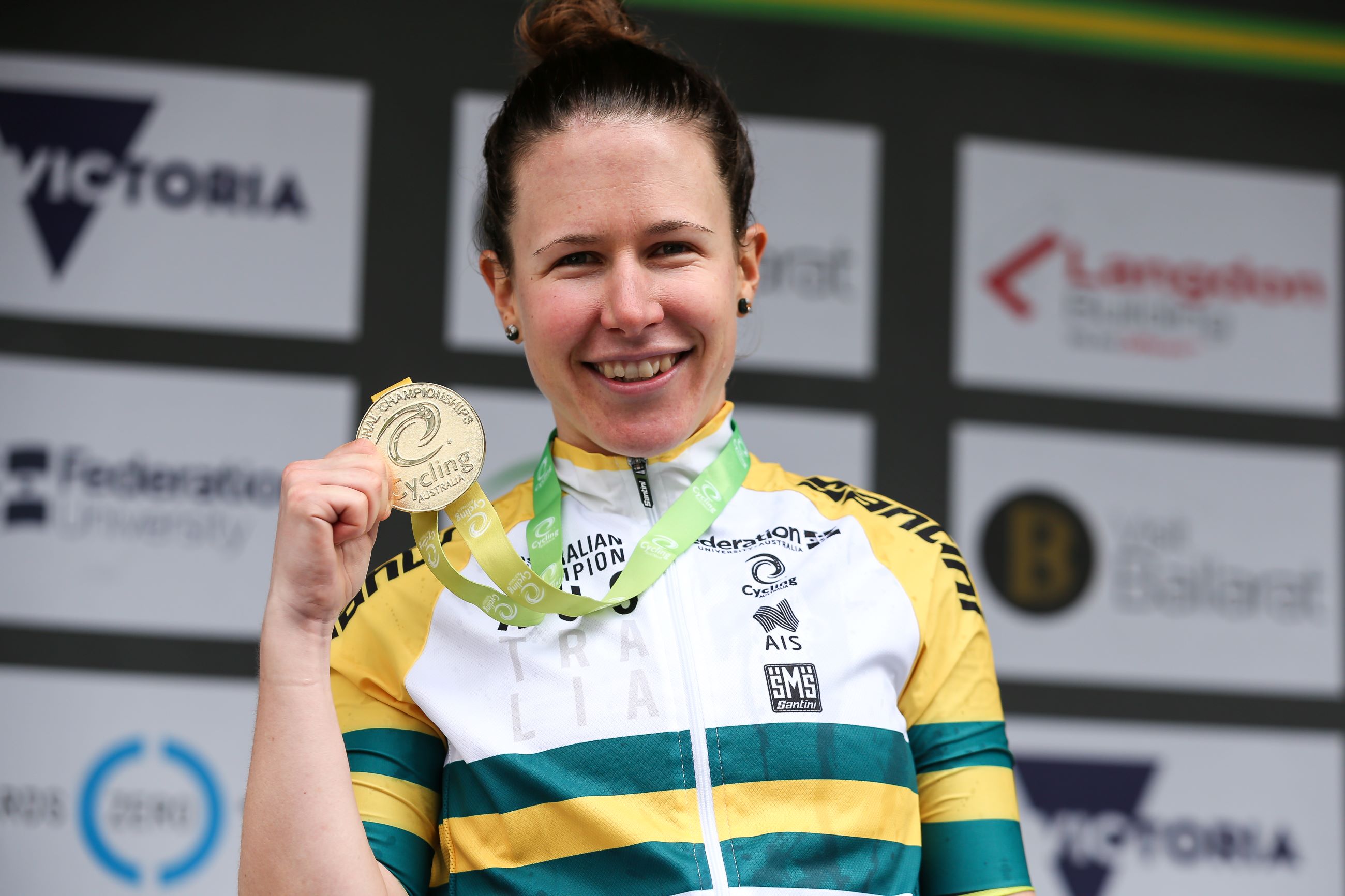 Australian road race elite women national champion Amanda Spratt poses with gold medal in the green-and-gold jersey after winning her third national title in Ballarat in 2020. Photo by Con Chronis.